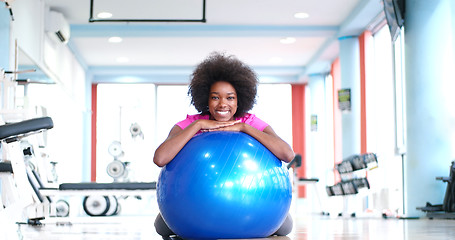 Image showing portrait of young afro american woman in gym on workout break