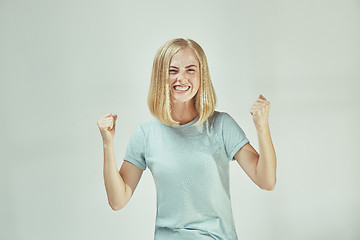 Image showing Winning success woman happy ecstatic celebrating being a winner. Dynamic energetic image of female model