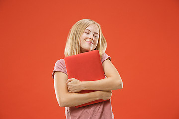 Image showing Businesswoman hugging laptop. Love to computer concept. Attractive female half-length front portrait