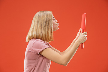 Image showing Businesswoman hugging laptop. Love to computer concept. Attractive female half-length front portrait