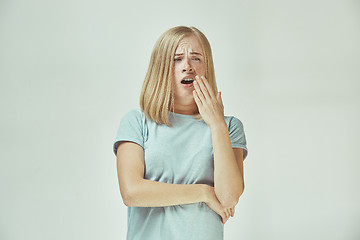 Image showing Beautiful bored woman bored isolated on gray background