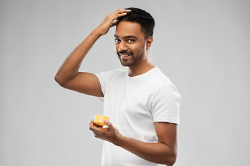 Image showing indian man applying hair wax or styling gel