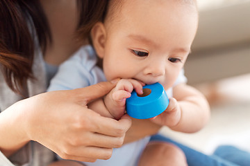 Image showing close up of asian baby boy with mother