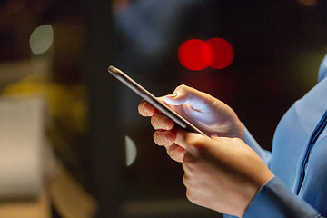 Image showing close up of businesswoman hands with smartphone