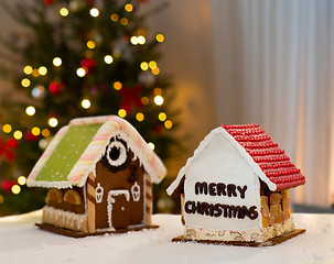 Image showing gingerbread houses over christmas tree lights