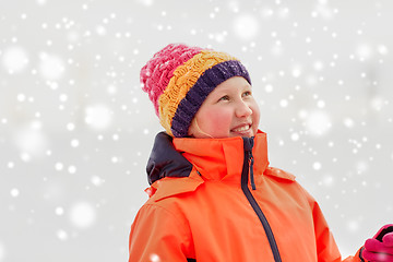 Image showing happy little girl in winter clothes outdoors