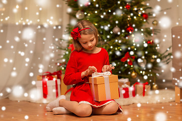 Image showing girl with christmas gift at home