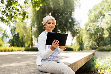 Image showing old woman with tablet pc and coffee at summer park