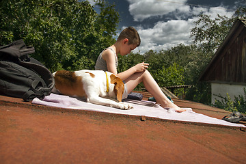 Image showing Boy playing on tablet