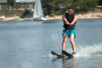 Image showing Man riding water skis