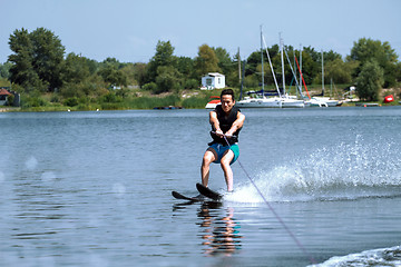 Image showing Man riding water skis