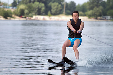 Image showing Man riding water skis