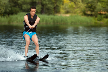 Image showing Man riding water skis