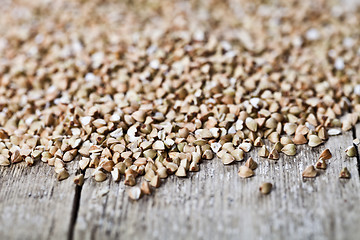 Image showing Organic green dry buckwheat seads closeup on rustic wooden backg