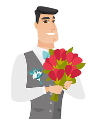 Image showing Young caucasian groom with bridal bouquet.