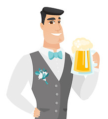 Image showing Young caucasian groom drinking beer.