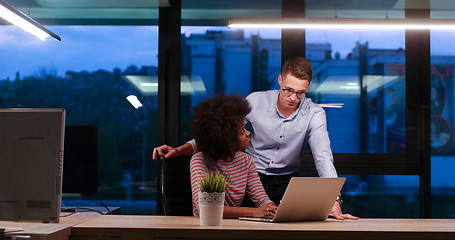 Image showing Multiethnic startup business team in night office