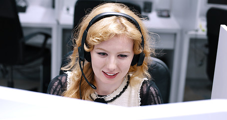 Image showing female call centre operator doing her job