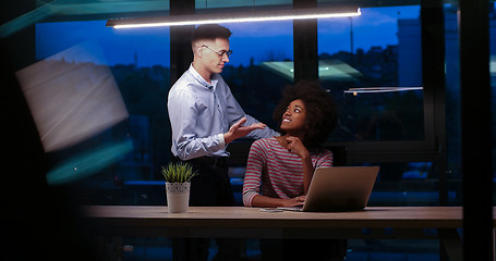 Image showing Multiethnic startup business team in night office