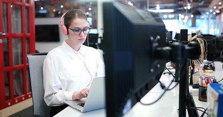 Image showing businesswoman using a laptop in startup office