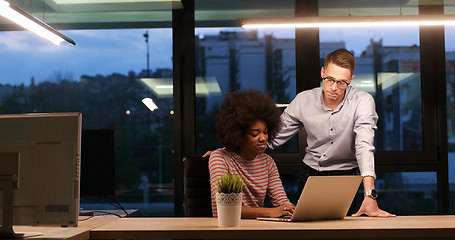 Image showing Multiethnic startup business team in night office