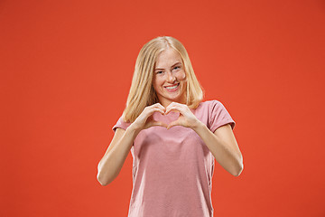 Image showing Portrait of attractive cute girl with kiss isolated over red background