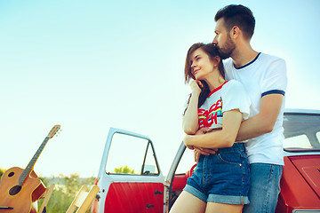 Image showing Couple resting on the beach on a summer day near river