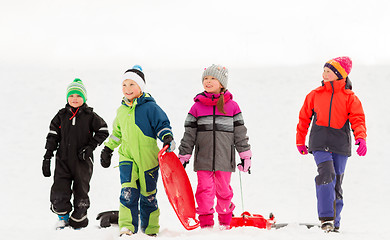 Image showing happy little kids with sleds in winter