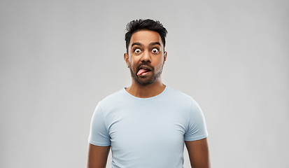 Image showing indian man making faces and showing his tongue