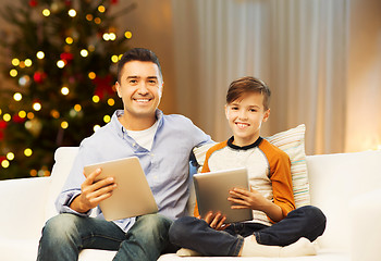 Image showing father and son with tablet computers on christmas