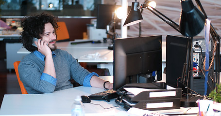 Image showing businessman working using a computer in startup office