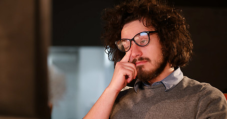 Image showing man working on computer in dark office