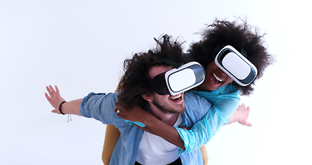 Image showing multiethnic couple getting experience using VR headset glasses