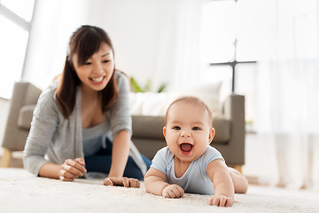 Image showing happy little asian baby boy with mother at home