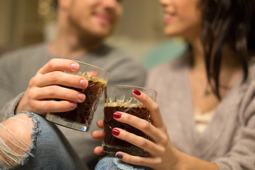 Image showing close up of happy couple drinking coffee at home