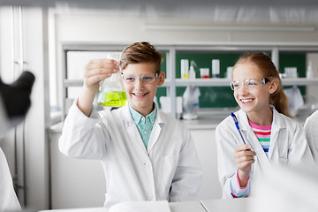 Image showing kids with test tubes studying chemistry at school