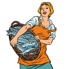 Image showing woman fisherman with a basket of fish. oceanic herring and cod