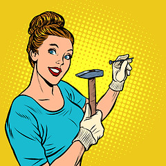 Image showing woman hammering a nail