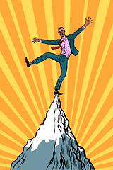 Image showing african businessman at the top of the mountain