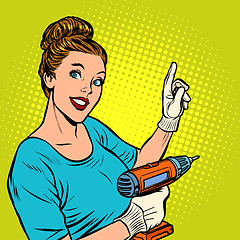 Image showing woman with hand drill