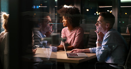 Image showing Multiethnic startup business team in night office