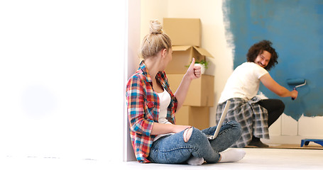 Image showing Happy couple doing home renovations