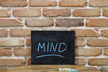 Image showing Chalk board with the word MIND drown by hand and chalks on woode