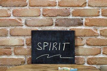 Image showing Chalk board with the word SPIRIT drown by hand and chalks on woo