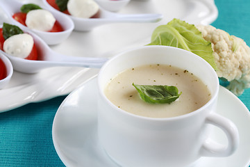 Image showing Cauliflower soup with fresh basil