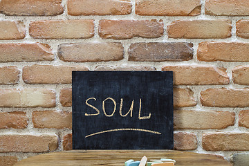 Image showing Chalk board with the word SOUL drown by hand and chalks on woode