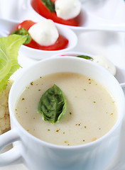 Image showing Cauliflower soup with fresh basil