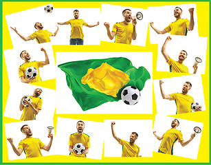 Image showing Brazilian fan celebrating on white background. The young man in soccer football uniform with ball standing at white studio. Fan, support concept. Human emotions concept.