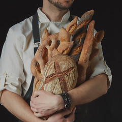 Image showing Baker keeps a variety of bread