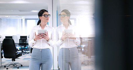 Image showing Business Woman Using Digital Tablet in front of Office